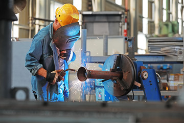 Workers are busy on the production line in an agricultural machinery factory., Luannan County,...