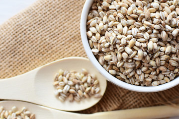 Raw barley grains, exhibited in containers on bottom in cloth
