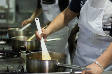 Obraz na płótnie Canvas Chef preparing food in the kitchen