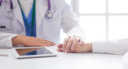 male doctor comforting patient who is in ambulance