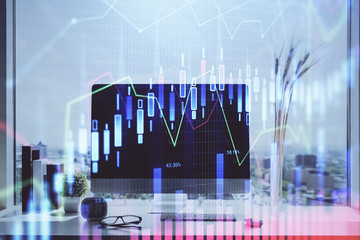 Stock market graph on background with desk and personal computer. Double exposure. Concept of financial analysis.