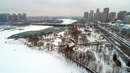 Snowscape of waterfront city, aerial photo