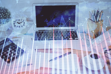 Stock market graph and table with computer background. Multi exposure. Concept of financial analysis.