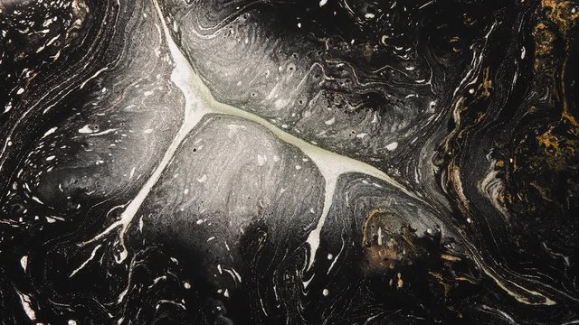 Fluid art. Chemical foam. Glitter white black bronze paint blend motion background.
