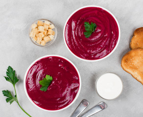eet cream soup with parsley on a light background top view