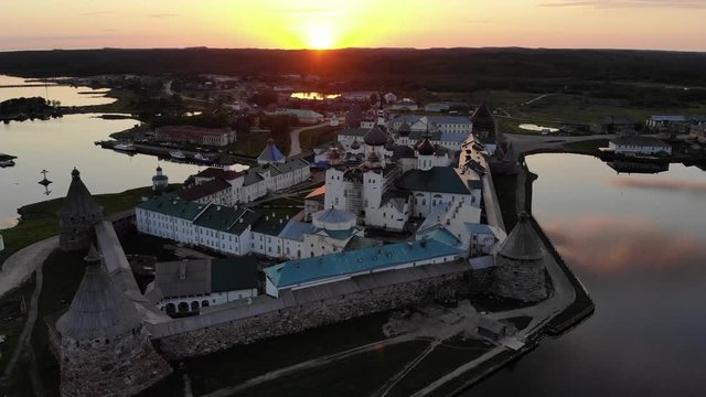Smooth cinematic flight over the Solovetsky monastery during a beautiful sunset. Solovetsky monastery is an old Russian Orthodox Church monastery, located on the Islands of the White sea at the North 