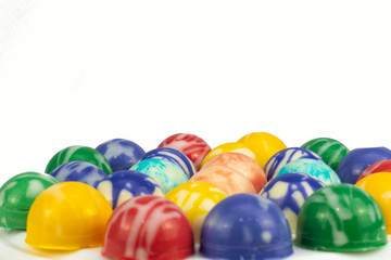 Fototapeta na wymiar colorful chocolate candies filling with lemon liqueur