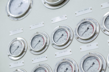 Fototapeta premium Dial pressure gauge for monitoring and measuring tire curing press manufacturing process, industry machine interface background