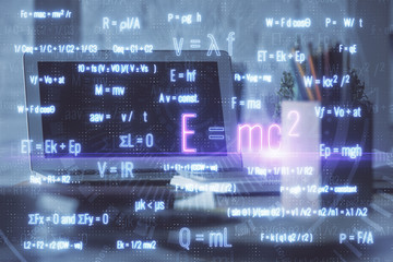 Desktop computer background and formula hologram writing. Double exposure. Education concept.