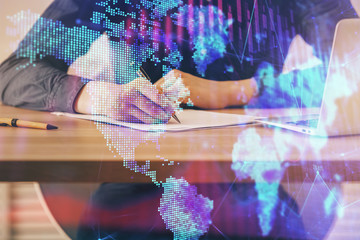 Double exposure hands with stock market chart.