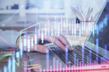 Double exposure of stock market graph with man working on laptop on background. Concept of financial analysis.