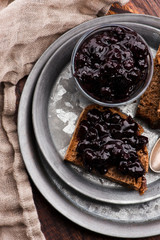 Bread with blueberry jam on the plate