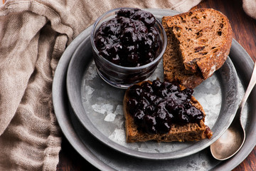 Bread with blueberry jam on the plate