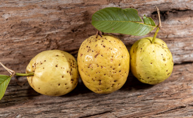 Fresh guavas on wooden background