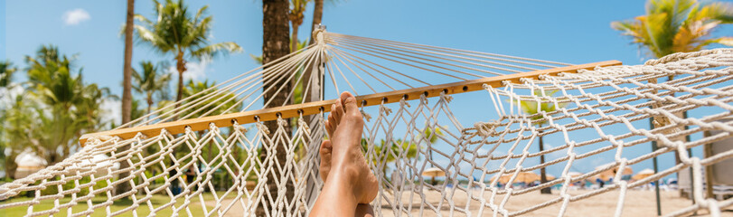 Caribbean beach selfie girl relaxing on hammock panoramic banner travel background panorama. Summer...
