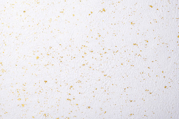 Fototapeta na wymiar 金箔を散らしたシワのある白い和紙の背景テクスチャー