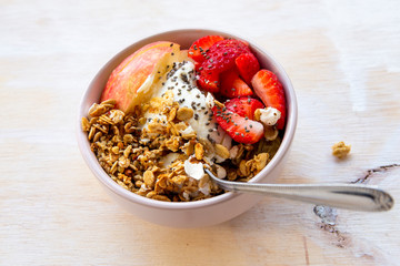 Granola with apple, strawberry and yogurt