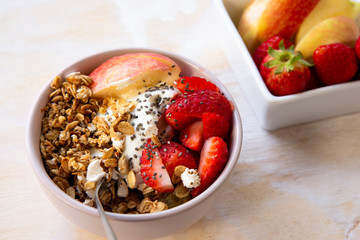 Granola with apple, strawberry and yogurt
