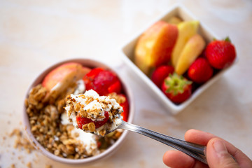 Granola with apple, strawberry and yogurt