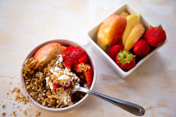 Granola with apple, strawberry and yogurt