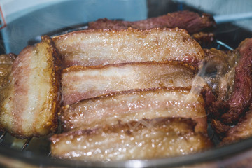 Thai roasted crispy pork on lettuce with Thai Spicy Sauce, Close up view