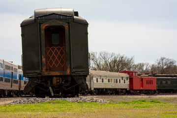 Fototapeta na wymiar Retired train cars in railroad graveyard