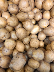 a lot of potatoes in the store close-up, top view