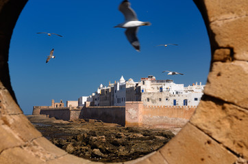 Fototapeta na wymiar North bastion and ramparts of Essaouira Morocco viewed from Sqala du Port keyhole window