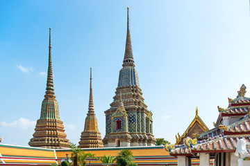 Fototapeta premium View to chedi of Temple of Reclining Buddha or Wat Pho complex. Bangkok, Thailand