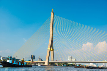 View to suspension Rama 8 Bridge across Chaophraya river at sunny day. Landmark building in Bangkok, Thailand