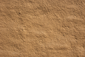 Soil wall texture of clay house structure, wall home made from mud with vintage tone picture. Soft picture