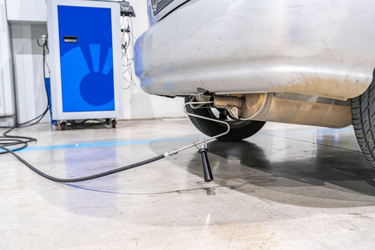 Emission control in the exhaust of an old car at a vehicle inspection station