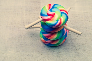 Lollipops on a wooden background. colorful candies close up