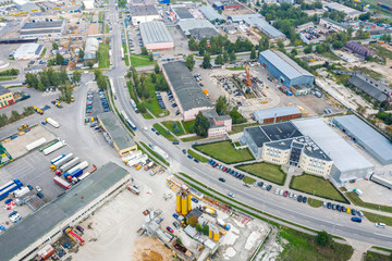 top down view of city industrial zone with plants, factories and warehouses