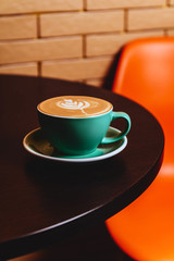 Cappuccino. Cup of Cappuccino Coffee on orange background