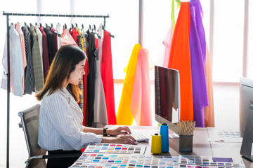 Asian women at work are fashion designers and tailors