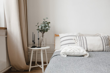 Interior cozy bedroom and comfortable bed in elegant classic bedroom