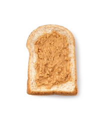 Fresh whole wheat bread covered with coarse peanut butter isolated on white background, clipping path