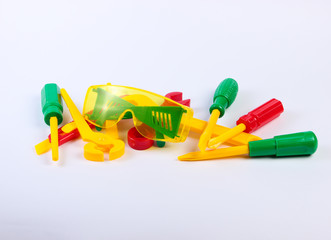 Set of children's toy work tools on a white background