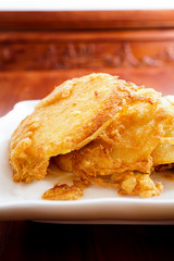 Fried bread slices with eggs in plate