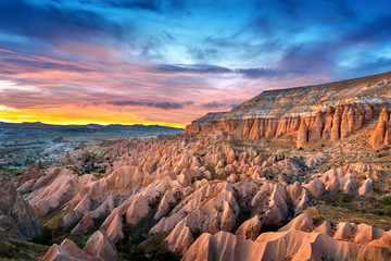 Beautiful mountains and Red valley  at sunset in Goreme, Cappadocia in Turkey. © tawatchai1990
