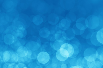abstract blue bokeh glitter sparkle background.
