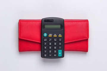 Calculator with leather wallet on white background. Family bujet, economical calculation,...