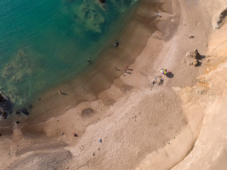 People play on the shore of a sandy beach at Huarmey´s seaside in Ancash region, Peru