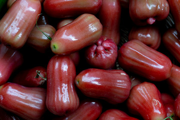Close up red rose apple that is stacked for nature background.