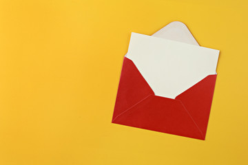 Red envelope with blank card on yellow background.