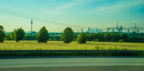 Fototapeta na wymiar Germany, Frankfurt, Sunrise, a view of the side of a road