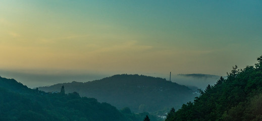 Germany, Frankfurt, Sunrise, a large body of water with a mountain in the background
