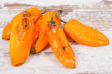 Old, moldy and wrinkled peppers. Unhealthy, decompose, spoiled vegetable