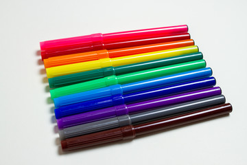 colorful felt-tip pens on the white background